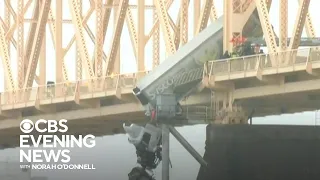 Driver rescued after wreck leaves big-rig dangling off Louisville bridge
