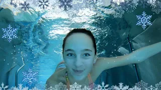 Carla Underwater swimming in a winter resort