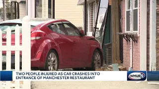 Two injured as car crashes into Manchester restaurant