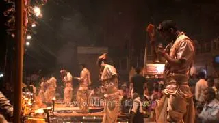 Ritualistic bell ringing creating an auspicious sound at Ganga Aarti in Varanasi