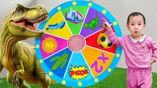 Kids and Tana playing Dinosaur Magic Wheel