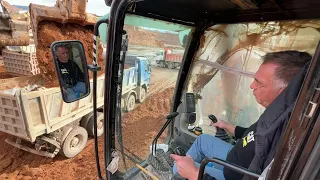 Caterpillar 365C Excavator Loading Mercedes And MAN Trucks - Operator View