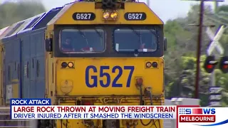 Rocks were thrown through the windscreen of the moving train leaving driver injured.