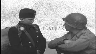 Hungarian schoolboys are interviewed by American soldiers of  US 11th Armored Div...HD Stock Footage