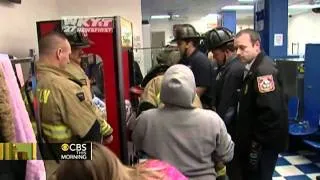 Girl crawls in arcade game, rescue caught on tape