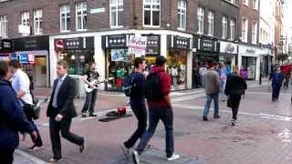 Street musician playing and singing Heart of Gold (Neil Young) in Dublin, Ireland