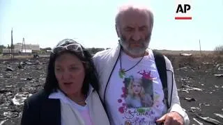 Family of passenger on downed flight MH17 visit crash site