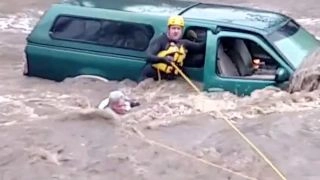 Risky swift water rescue caught on camera