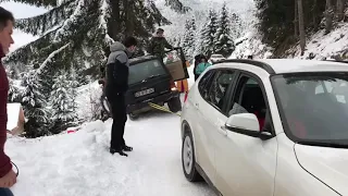 BMW X1 xdrive pulling out Jeep Cherokee in snow