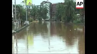 Landslides and flash floods triggered by two days of heavy rain kill dozens of people