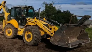 Working with the backhoe New holland B115