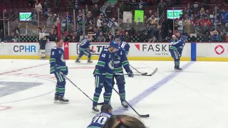 Canucks warm up