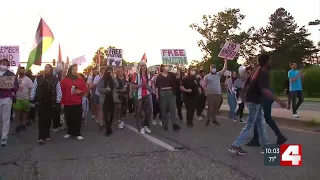 Anti-war protesters march through St. Louis streets near Washington University