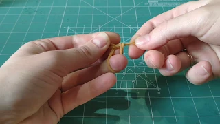 How to make a knot from the thin rubber band during assembly of the Ugears Card Holder