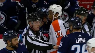 Flyers' Simmonds with a show of sportsmanship after taking down Jets' Ehlers