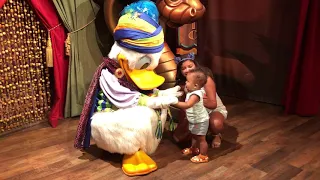 Cute baby meets Donald Duck at Magic Kingdom