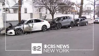 Surveillance video shows cars being set on fire in Queens