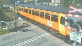 Video shows shocking pram near-miss at level crossing