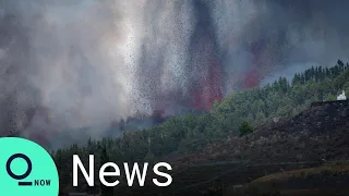 Lava Flows Over Road on Spain's La Palma After Volcano Erupts