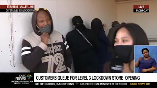 Customers queue for level 3 lockdown liquor store opening