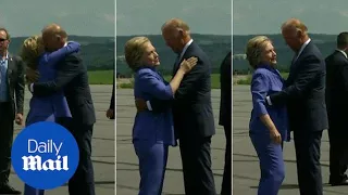 Let her go, Joe! Biden's awkwardly long hug with Hillary - Daily Mail