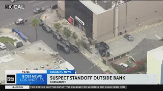 Koreatown bank suspect moves to a vehicle outside