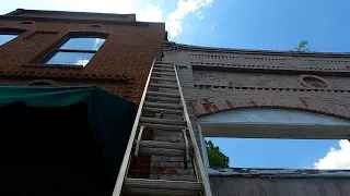 REMOVING DANGEROUS LOOSE BRICKS FROM HISTORIC BUILDING