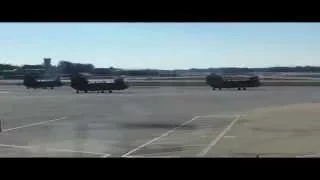 Three Chinook helicopters taking off