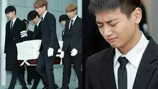 crying at the sight of Jonghyun's funeral