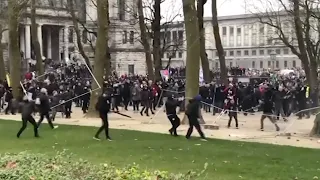 COVID-19 protesters storm police barricade in Brussels