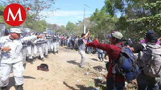 Migrantes se enfrentan a Guardia Nacional en frontera México-Guatemala