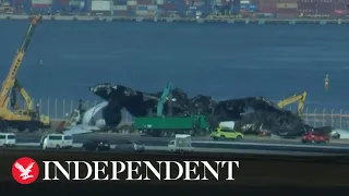 Live: Japan aircraft wreckage to be removed following airport collision