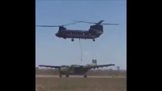 Recording Breaking ! A Chinook Helicopter Carrying A Caribou Aircraft With Ease