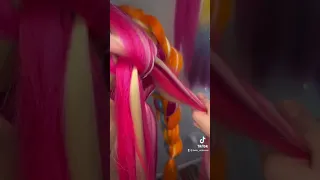 Dragon braids with orange braiding hair on mannequin. #dragonbraid #hairbraiding
