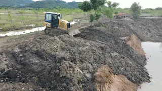 Experience Skill Operator Techniques CAT Bulldozer Clearing Dirt Mud with Dump Truck Moving Mud