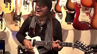 Matthias Jabs Playing In A Guitar Shop