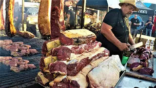 Large Grills with Huge Steaks Grilled Texas-Style. Yummy Street Food Biker Fest 2022. Lignano, Italy