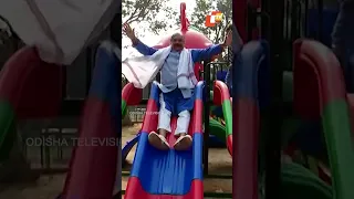 Congress MLA Sura Routray plays slide in childrens park