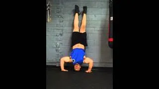 T. Crocker Handstand push-ups. Weighing 275lbs.