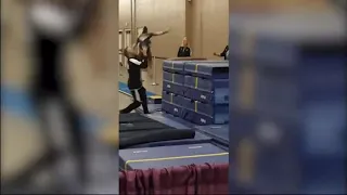 Coach saves gymnast from injury by catching her in mid air as she tumbled off superly saves