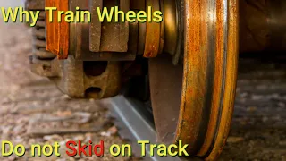 Why train wheels doesn't skid on tracks