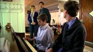 Reid plays the piano