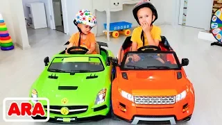 فلاد ونيكيتا يركضان على ألعاب سيارات العائلة الممتع