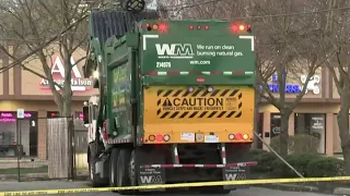 Garbage truck driver freed after hitting pole with live power lines