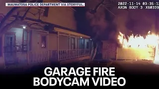 Police officer wakes residents after spotting garage on fire