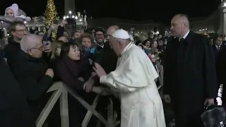 Pope Francis slaps woman's hand to free himself from her grip