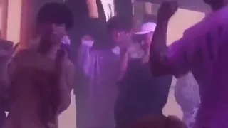 A group of guys dancing to Lisa’s crab dance at a club in China