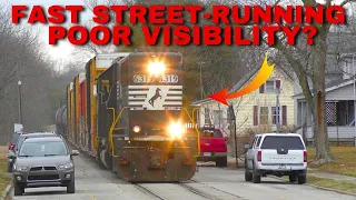 FAST train takes over the road!!!  Train runs LONG-HOOD forward Poor Visibility on Street-Run