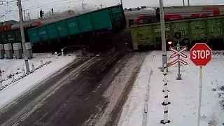 Truck torn apart by two trains at rail crossing in Kazakhstan | CCTV camera footage