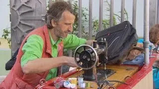 Man uses sewing machine to mend struggling neighborhood